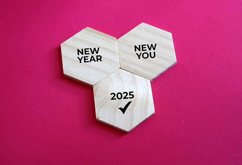 Wooden blocks with New Year's resolutions for 2025